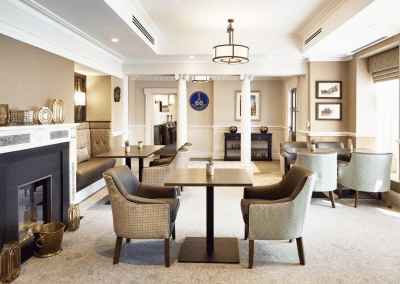 Interior picture of a Signature care home, featuring calming and comfortable furniture in a range of rooms, to support senior living.