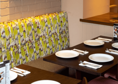 Bespoke pub furniture featuring bold fabrics, vibrant colours, and custom fixed seating by Jameson Seating