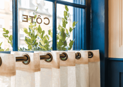 Bespoke café curtains, cushions, and soft furnishings, combining Parisian charm with durable, stylish design.