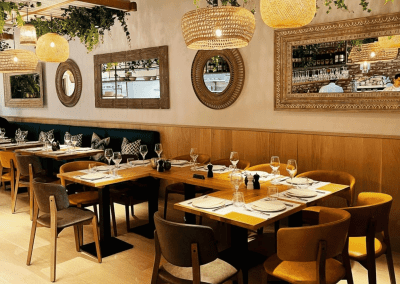 Bespoke bar and restaurant furniture including dining chairs, bar stools and tables, featuring stylish Mediterranean-inspired design.