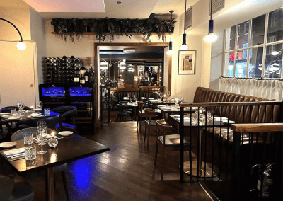 Bespoke eyelet screen curtains for gastropubs, creating a stylish and private restaurant space.