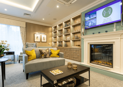 Interior picture of a residential care home, featuring calming and comfortable furniture in a range of rooms, to support senior living.