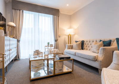 Interior picture of a residential care home, featuring calming and comfortable furniture in a range of rooms, to support senior living.