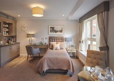 Interior picture of a residential care home, featuring calming and comfortable furniture in a range of rooms, to support senior living.