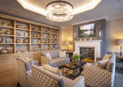 Interior picture of a residential care home, featuring calming and comfortable furniture in a range of rooms, to support senior living.