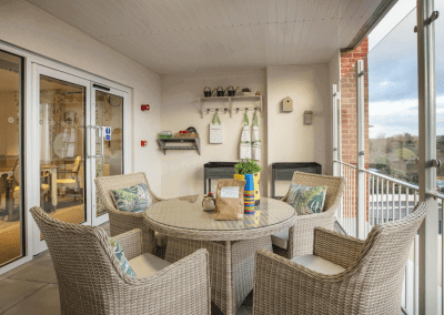Interior picture of a residential care home, featuring calming and comfortable furniture in a range of rooms, to support senior living.