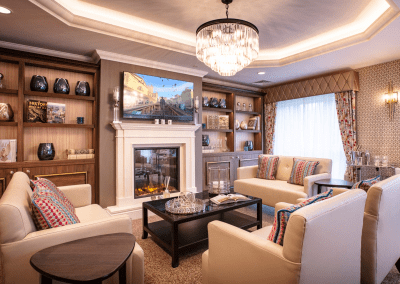 Interior picture of a residential care home, featuring calming and comfortable furniture in a range of rooms, to support senior living.