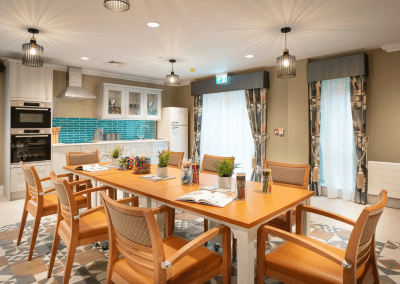 Interior picture of a residential care home, featuring calming and comfortable furniture in a range of rooms, to support senior living.