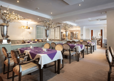 Interior picture of a residential care home, featuring calming and comfortable furniture in a range of rooms, to support senior living.