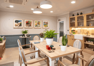 Interior picture of a residential care home, featuring calming and comfortable furniture in a range of rooms, to support senior living.