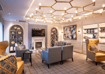 Interior picture of a residential care home, featuring calming and comfortable furniture in a range of rooms, to support senior living.
