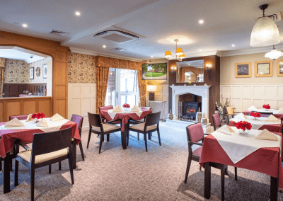 Interior picture of a residential care home, featuring calming and comfortable furniture in a range of rooms, to support senior living.