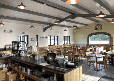 Bespoke café furniture for Rickyard Café in Romsley, featuring warm, rustic interiors and comfortable seating.