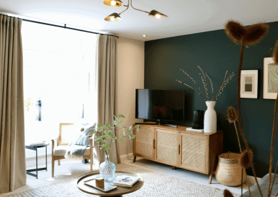 Interiors of show homes featuring bespoke curtains and blinds by Jameson Seating, complementing family-friendly, modern living spaces.
