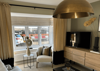 Interiors of show homes featuring bespoke curtains and blinds by Jameson Seating, complementing family-friendly, modern living spaces.