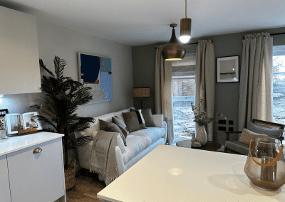Interiors of show homes featuring bespoke curtains and blinds by Jameson Seating, complementing family-friendly, modern living spaces.