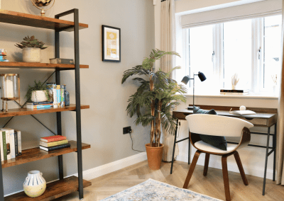 Interiors of show homes featuring bespoke curtains and blinds by Jameson Seating, complementing family-friendly, modern living spaces.