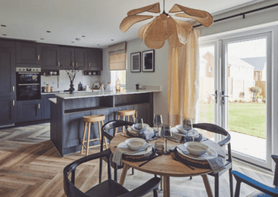 Interiors of show homes featuring bespoke curtains and blinds by Jameson Seating, complementing family-friendly, modern living spaces.