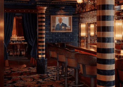 Bespoke curtains and soft furnishings at Ambassadors Clubhouse London, featuring luxurious fabrics and elegant design details that enhance the restaurant’s sophisticated atmosphere.