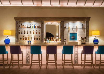 Handcrafted bespoke furniture supplied to Blue Waters Hotel, Antigua, showcasing British design, quality, and craftsmanship in a Caribbean setting.
