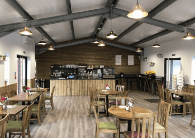 Bespoke café furniture for Rickyard Café in Romsley, featuring warm, rustic interiors and comfortable seating.