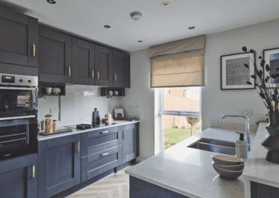 Interiors of show homes featuring bespoke curtains and blinds by Jameson Seating, complementing family-friendly, modern living spaces.