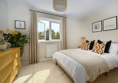 Interiors of show homes featuring bespoke curtains and blinds by Jameson Seating, complementing family-friendly, modern living spaces.