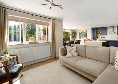 Interiors of show homes featuring bespoke curtains and blinds by Jameson Seating, complementing family-friendly, modern living spaces.
