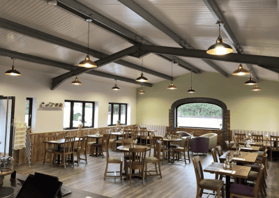 Bespoke café furniture for Rickyard Café in Romsley, featuring warm, rustic interiors and comfortable seating.