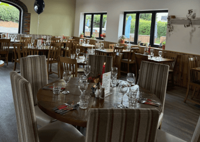 Bespoke café furniture featuring warm, rustic interiors and comfortable seating.