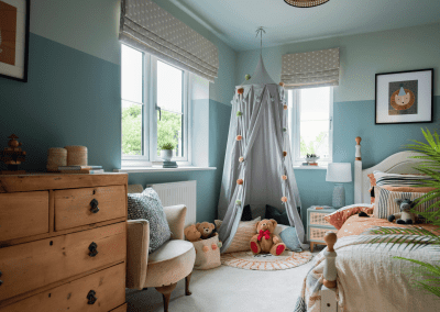 Interiors of show homes featuring bespoke curtains and blinds by Jameson Seating, complementing family-friendly, modern living spaces.