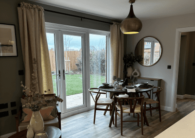 Interiors of show homes featuring bespoke curtains and blinds by Jameson Seating, complementing family-friendly, modern living spaces.