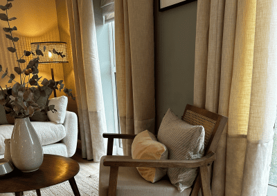 Interiors of show homes featuring bespoke curtains and blinds by Jameson Seating, complementing family-friendly, modern living spaces.