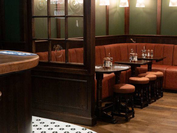 Interior of the a member’s club Tavern, with bespoke and refurbished furniture for a fresh and modern update.