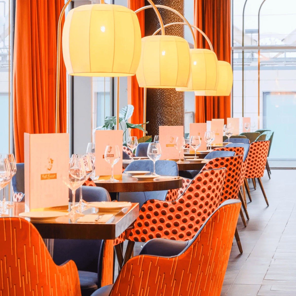 Bespoke restaurant furniture for a restaurant and patisserie featuring elegant finishes, upholstered seating, and a luxurious dining atmosphere.